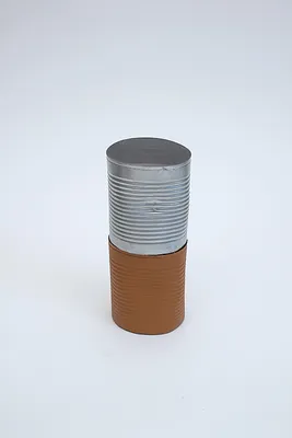 Can (dented, rusted) and Can (dented)