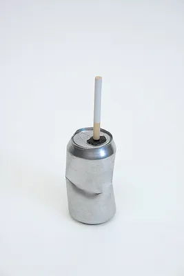 Drink Can (dented) and Cigarette