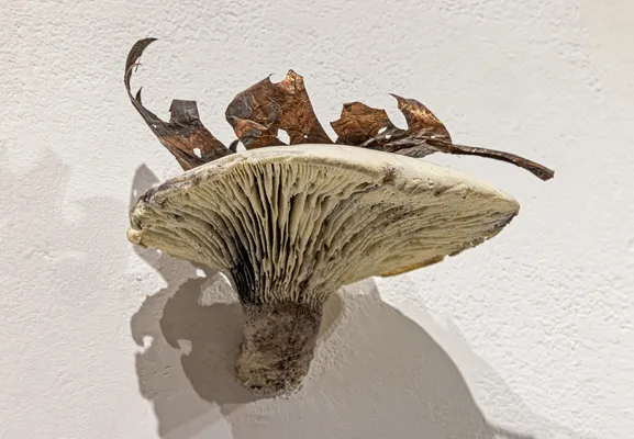 Mushroom does not know that leaf is sticking on it. Leaf does not know that it is on mushroom.